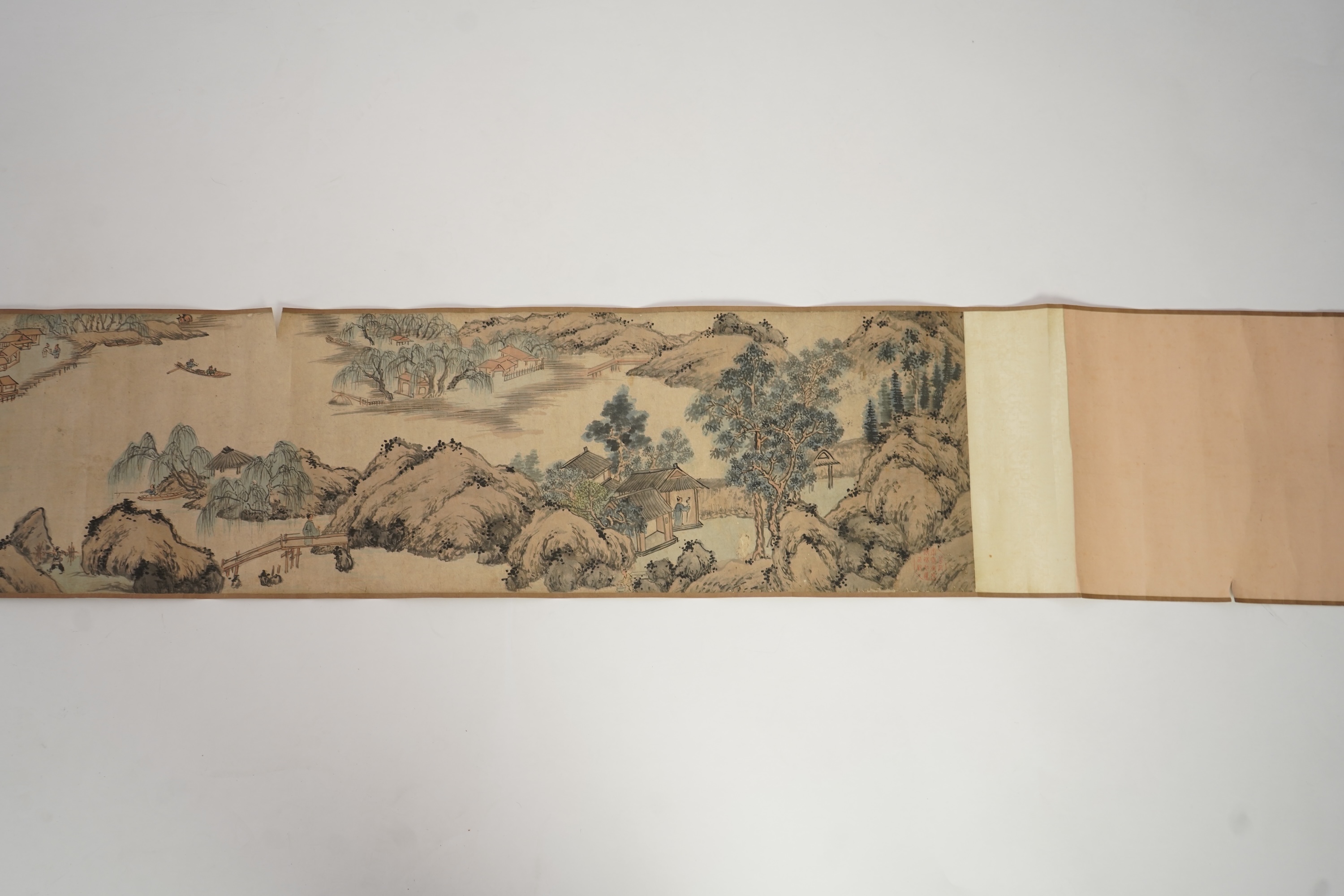 Chinese School , (Qing dynasty), Figures in a mountainous river landscape, Ink and colour on paper handscroll, 268.5cm x 29cm excluding borders